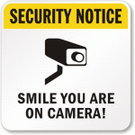 smile you are on camera surveillance sign