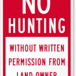 Sign that reads no hunting without written permission from landowner.