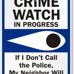 A Neighborhood Watch sign with an eye announcing that crime watch is in progress.