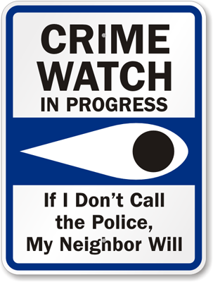 A Neighborhood Watch sign with an eye announcing that crime watch is in progress.