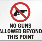 No guns allowed beyond this point sign