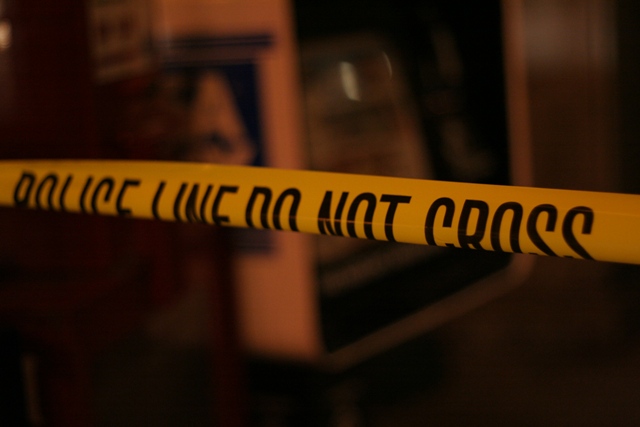 police tape Yellow police tape across a crime scene.