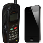 An iPhone next to an old motorola.